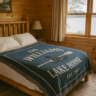 A custom woven blanket with a loom and a paddle with The Williams Lake House Est 2025