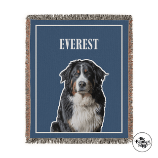 Blanket with a dog illustration and 'Everest' text on a blue background, featuring 'The Blanket Shop' logo.


