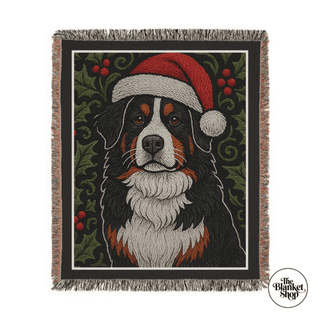Custom Woven blanket with a dog wearing a Santa hat design on a green background and The Blanket Shop Logo