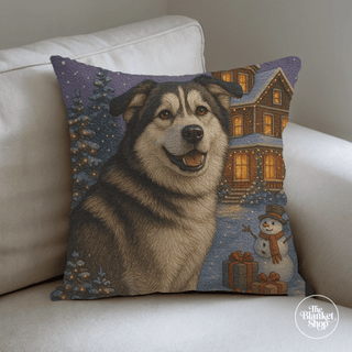 Custom throw pillow with a handsome dog and winter scene on a beige couch with The Blanket Shop Logo