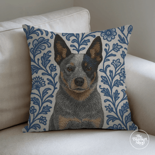 Decorative pillow with a dog design on a beige couch