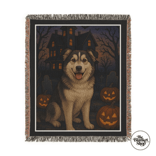 Halloween-themed custom throw blanket with a dog and pumpkins design, featuring 'The Blanket Shop' logo.