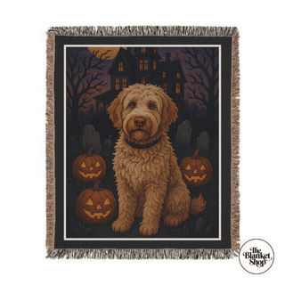 Halloween-themed custom throw blanket with a dog and pumpkins design, featuring 'The Blanket Shop' logo.