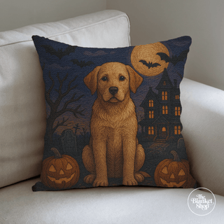 Halloween-themed throw pillow with a personalized dog design on a white couch from The Blanket Shop