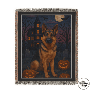 Personalized custom throw blanket with a german shepard dog and a spookey halloween setting with The Blanket Shop Logo