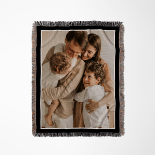 Personalized photo blanket with a family of four on a white background from The Blanket Shop