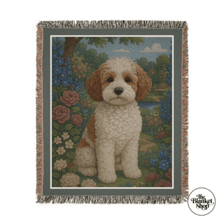 Personalized throw blanket with a dog design in a garden setting, featuring The Blanket Shop logo.
