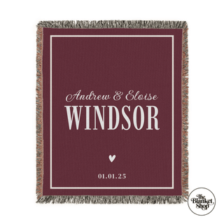Personalized throw blanket with names and date on a red background with The Blanket Shop Logo
