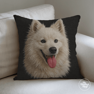 Woven Cotton Throw Pillow with a dog's face design on a white couch from The Blanket Shop