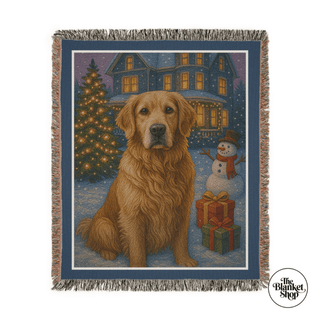 Woven blanket with a Christmas scene featuring a dog, tree, and house and The Blanket Shop Logo