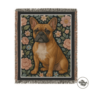 Woven blanket with a dog and floral design, featuring 'The Blanket Shop' logo.