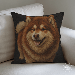 Woven cotton throw pillow with a dog design on a white couch, featuring 'The Blanket Shop' logo.